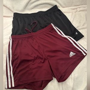 2 pairs of adidas and champion athletic shorts.